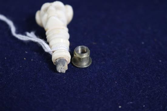 A carved ivory seal, a bone bodkin case and a miniature ivory handled cork screw